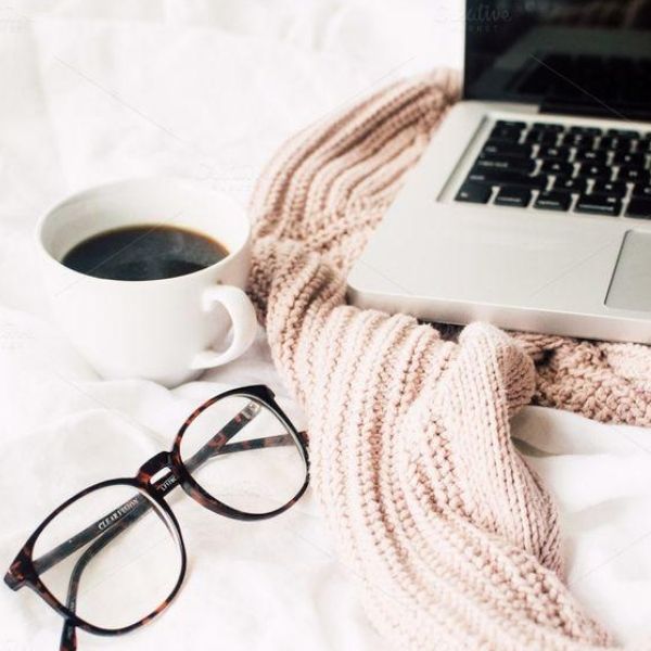 laptop, glasses and a mug of coffee