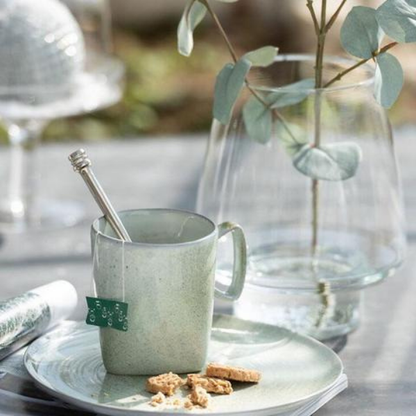Image of cup and vase indiactying the calm and peceful surroundings related to self care & recharge the batteries