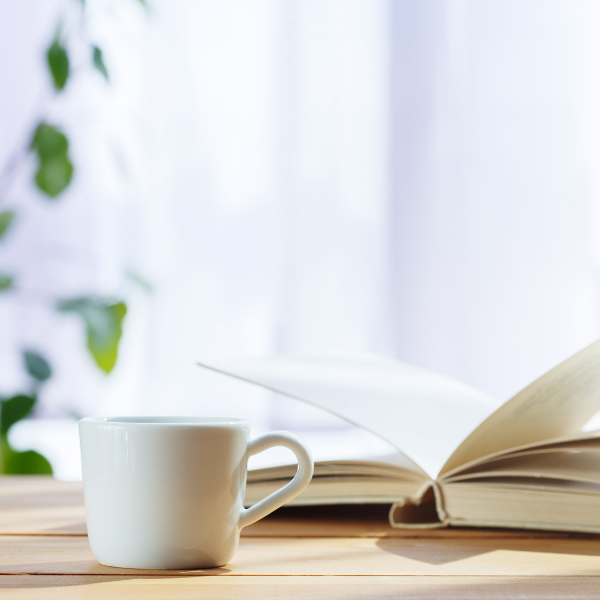 image of a cup and a notebook for journalling - peace and quiet to recharge the batteries