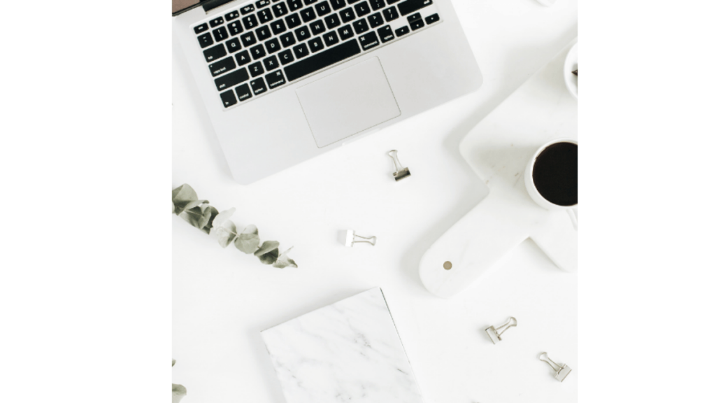 flatly view of a laptop, coffee and chocolate, all the tools for the power of an hour