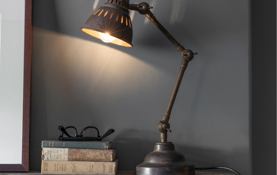 exam season, image of books, glasses and a reading lamp