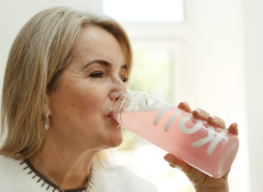 Claire drinking a kollo drink at home